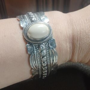 Intricate Silver and Cream Cuff Bracelet with Ornate Design